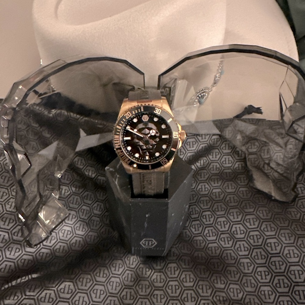 PP watch with gold and brown bracelet